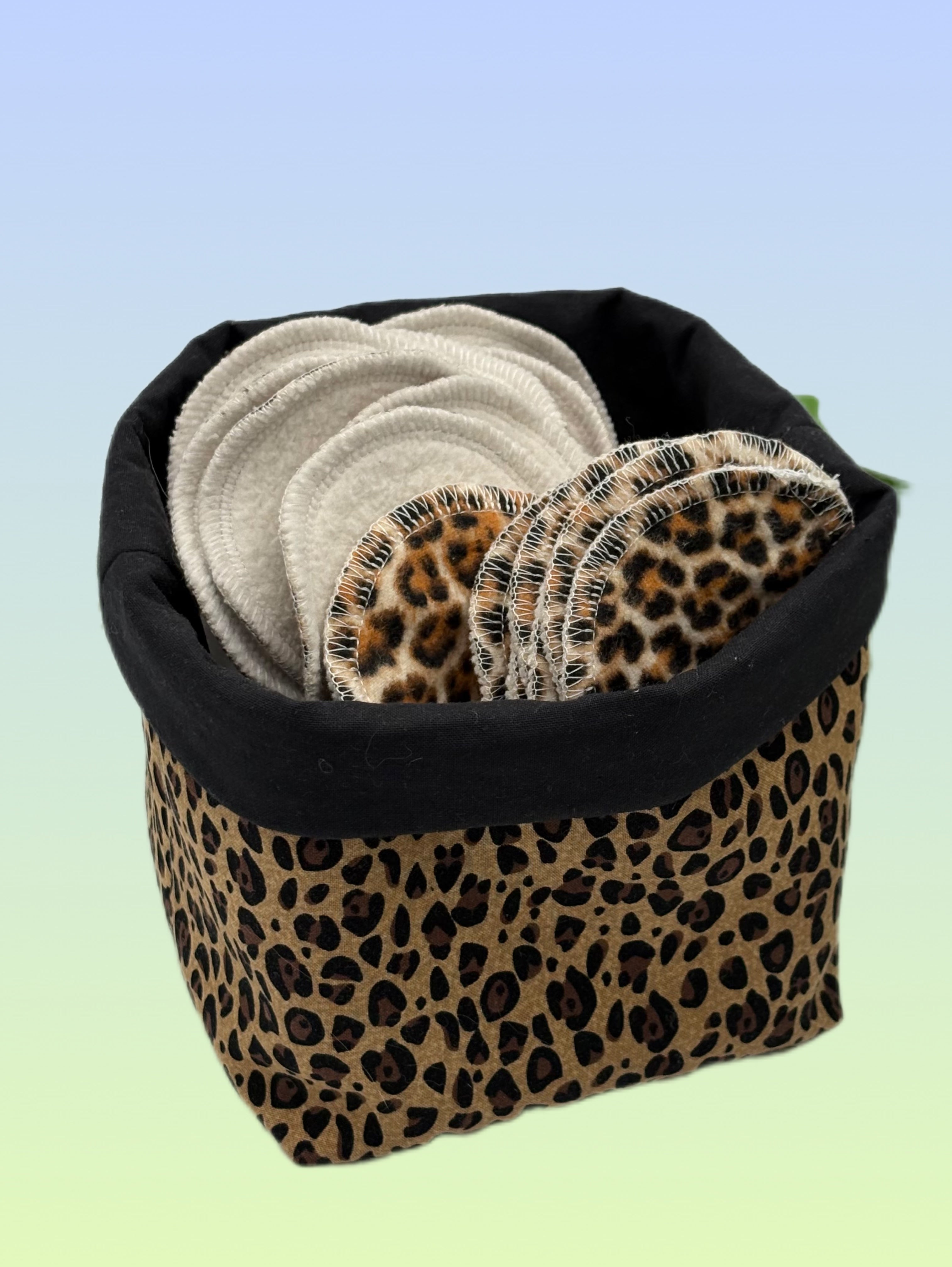 Handmade reusable makeup remover pads with leopard print and cotton terry cloth rounds in a leopard print fabric basket