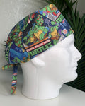 Colorful Teenage Mutant Ninja’ Turtles scrub cap on a mannequin head with a plant, against a white background