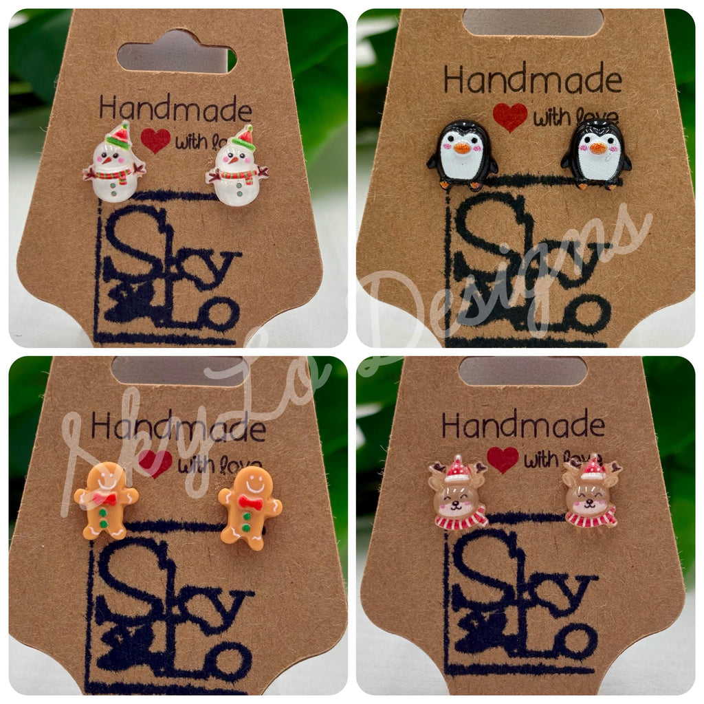 Set of four pairs of christmas themed earrings on display with 'SkyLo' branding.