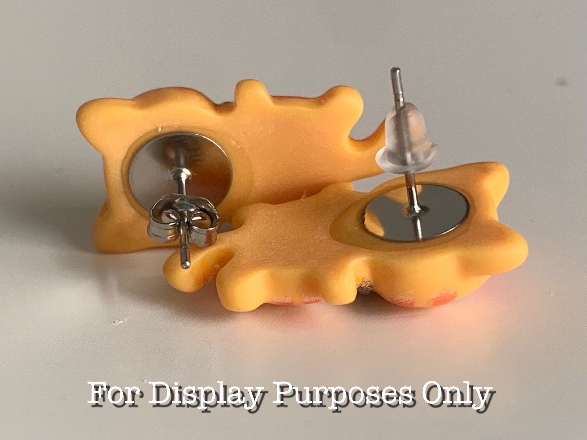 Orange cat-shaped earrings on a white background with 'For Display Purposes Only' text.