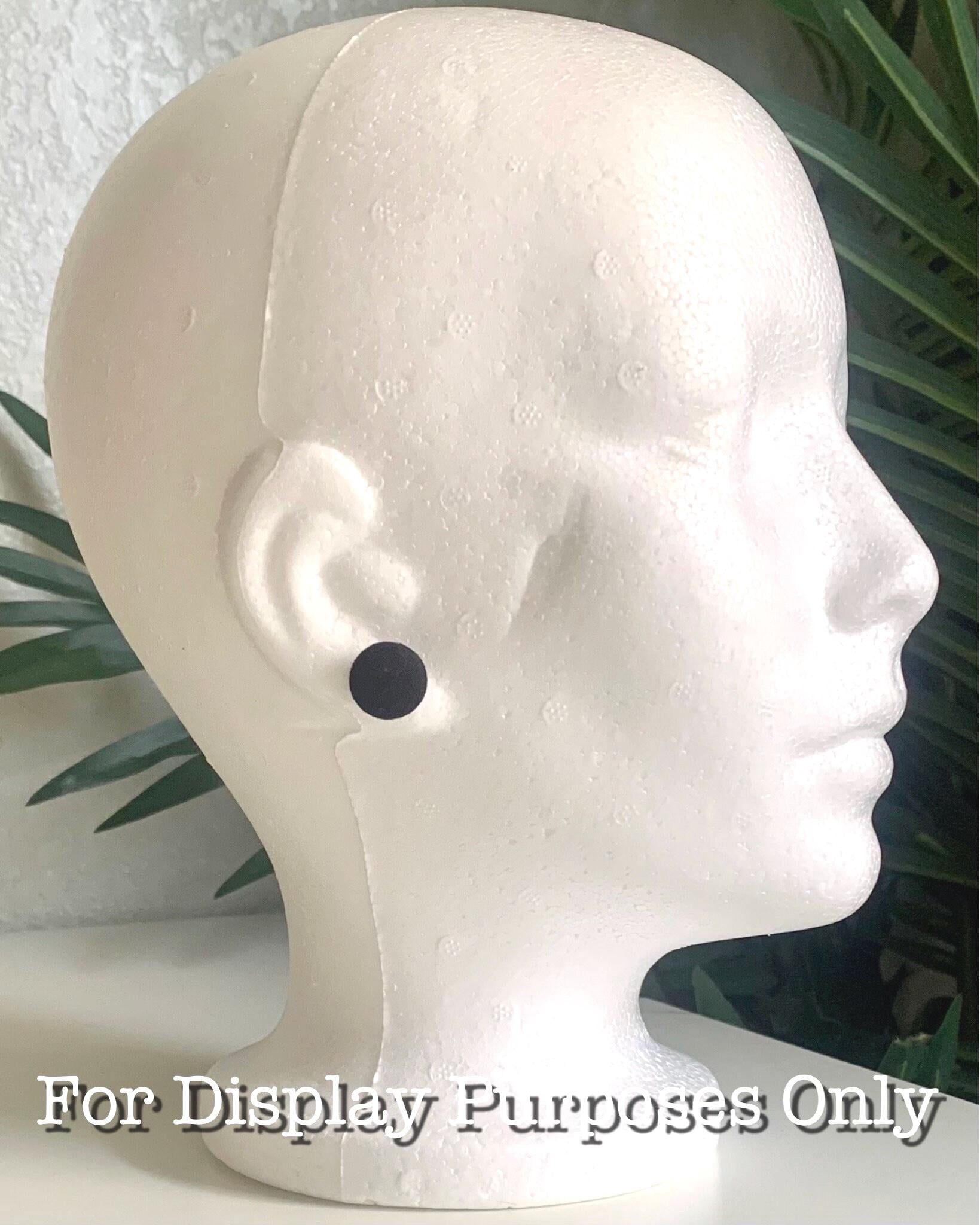 Mannequin head with a black earring against a neutral background with text 'for display purposes only'