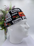 Mannequin head wearing a Cruella DeVil scrub cap with a decorative plant in the background.