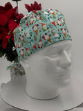 Colorful gnome pattern with baby blue background scrub cap on a mannequin head with a red floral arrangement in the background