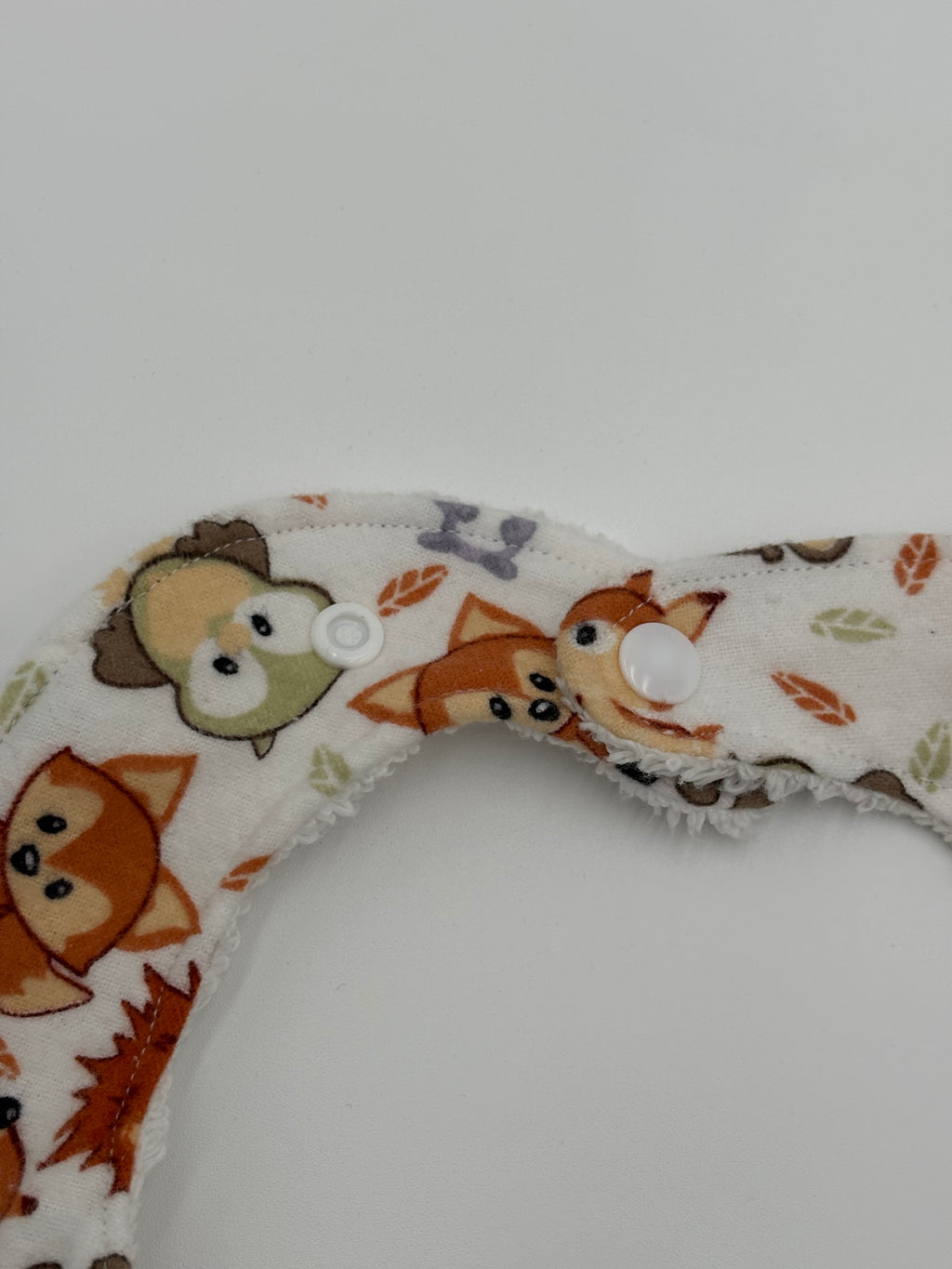 Woodland animals bib close up of snaps 