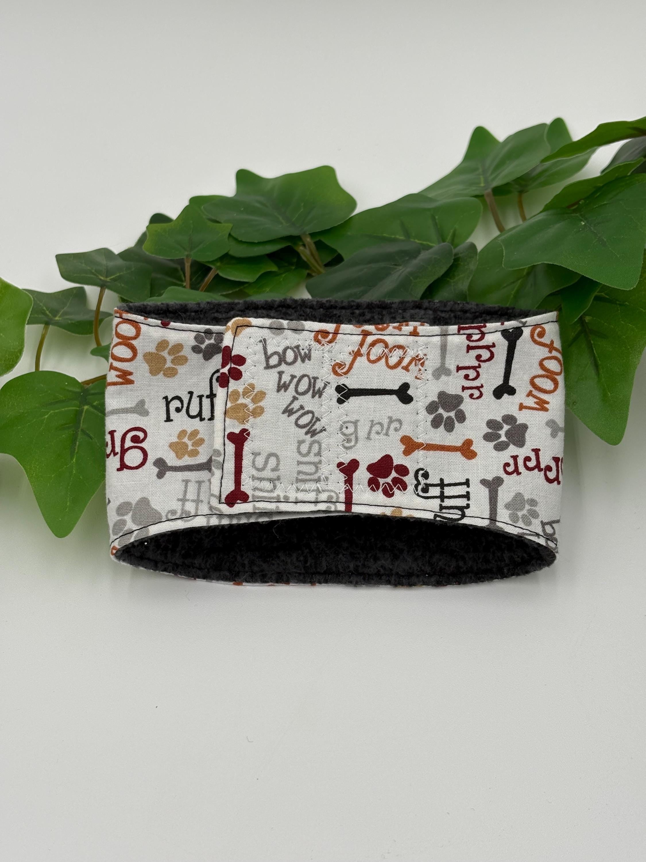 patterned belly band on a white background next to green plant