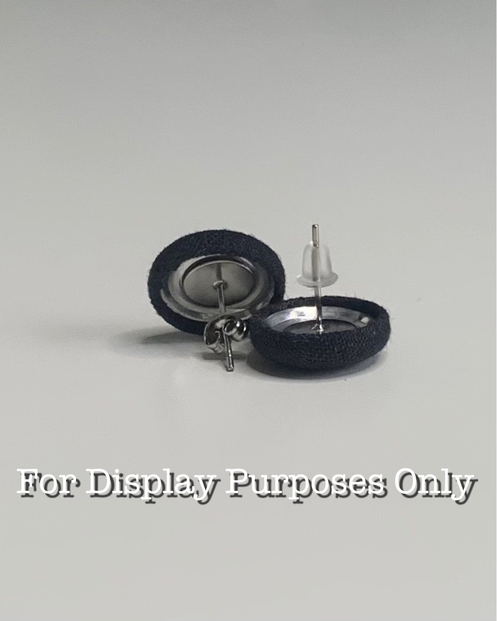 Two small round objects with metallic centers on a gray background, labeled 'For Display Purposes Only'.