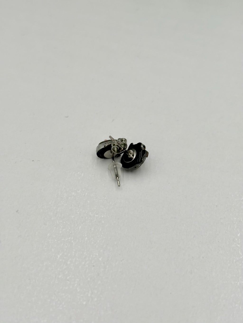 Penguin earring on a white background