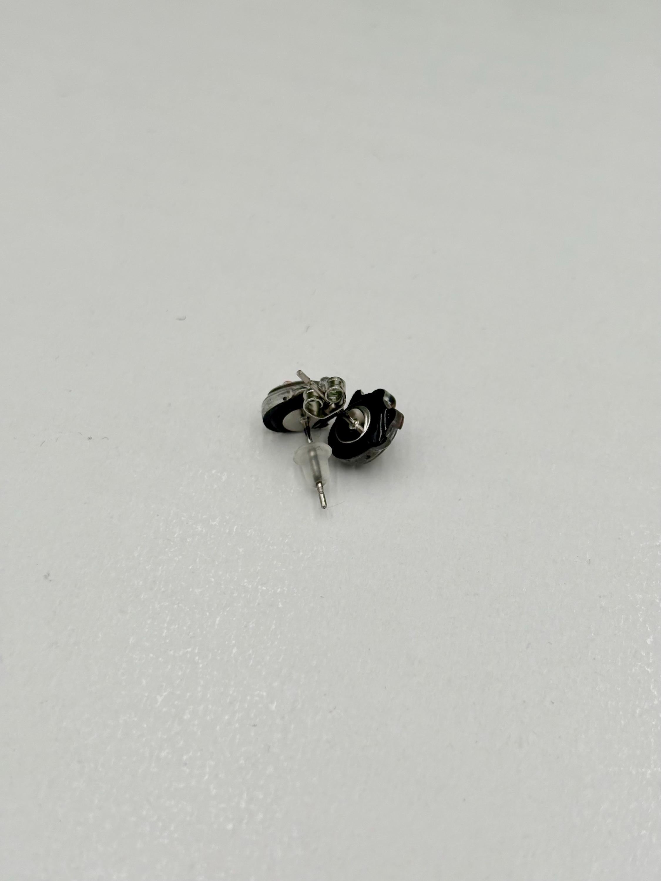 Penguin earring on a white background