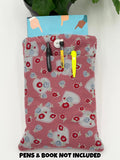 Floral and heart patterned book sleeve with pens and book on a white background with the text “pens and book not included”