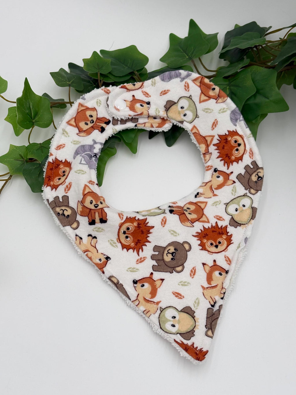 Baby bib with animal pattern on a white background