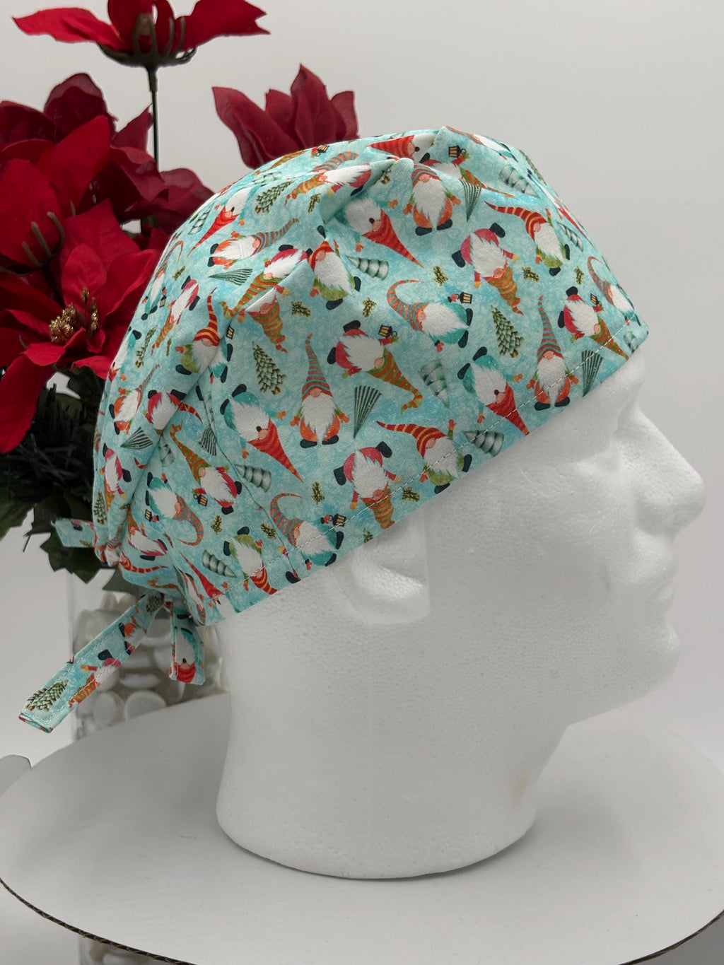 Surgical cap with gnome pattern on a mannequin head against a white background