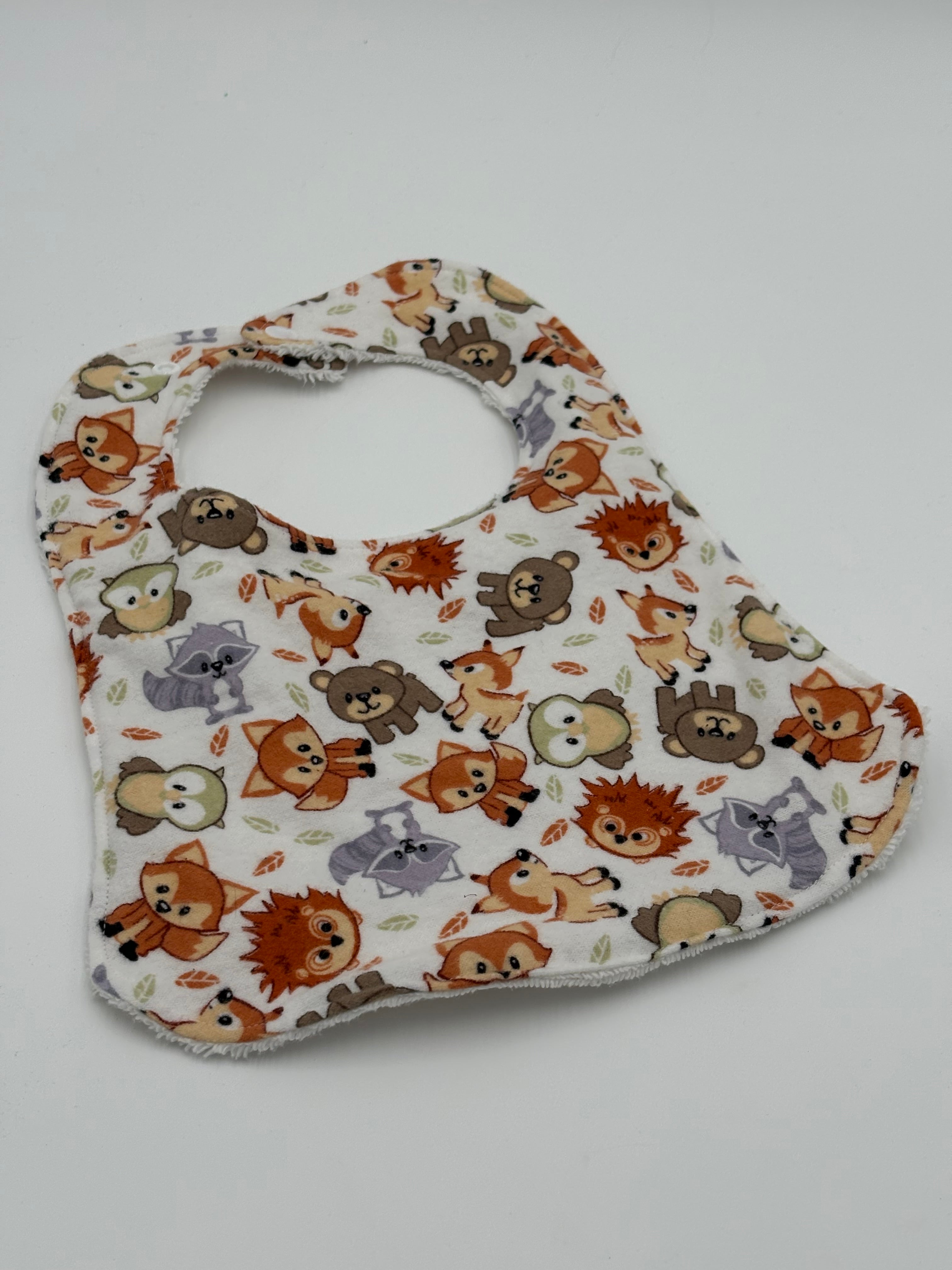 Baby bib with animal pattern on a white background