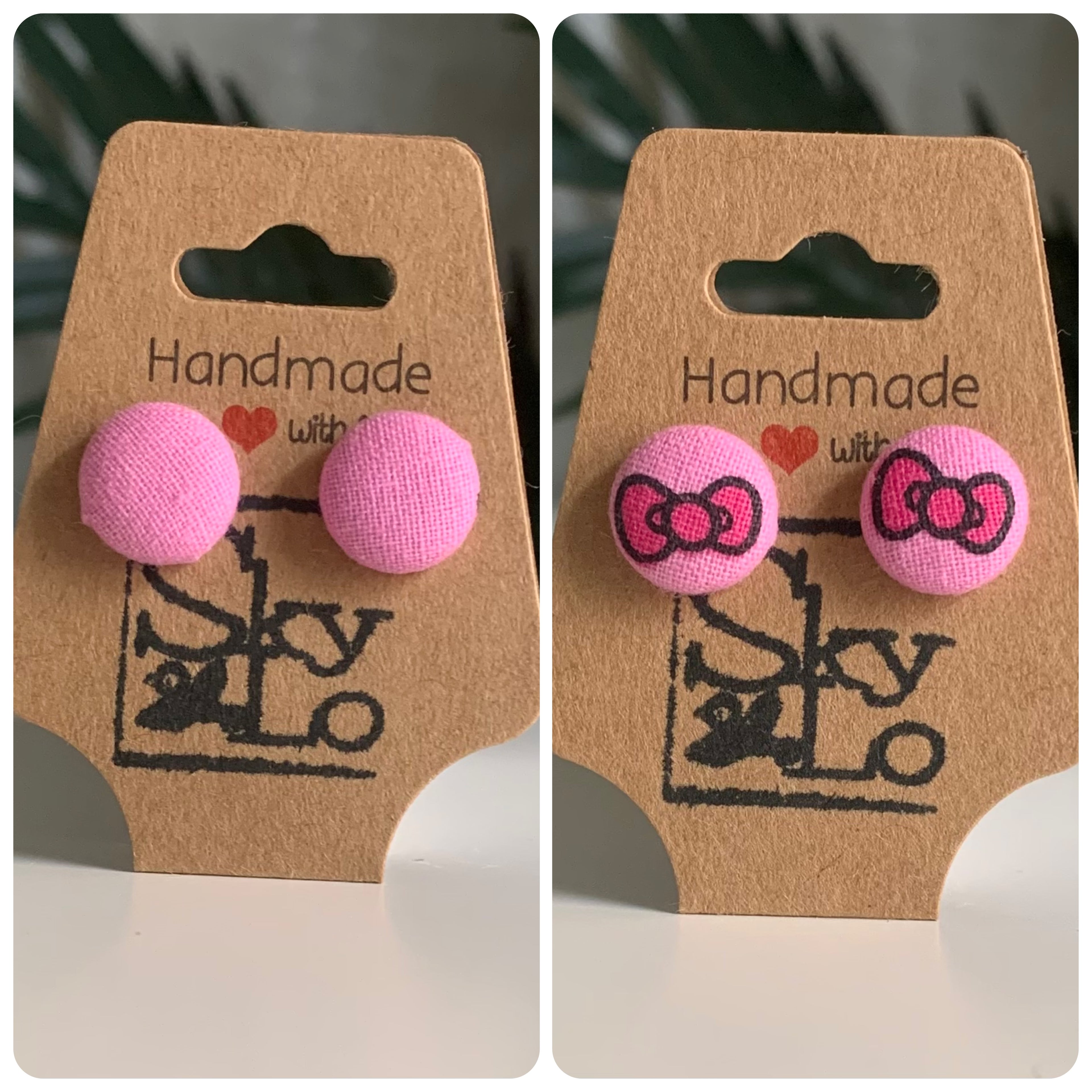Pair of pink earrings with a pair of pink earrings with bow design on brown 'Handmade with Love' card.