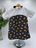 Toddler shirt with white top a d ray bottom with hearts on a white background with a vase of flowers in the background 