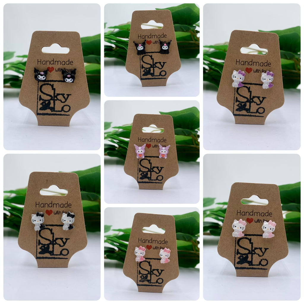 7 kitty style earrings arranged in a collage. 