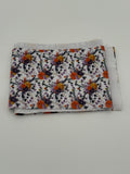 Folded fabric with Autumn flowers pattern on a white background