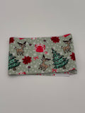 Folded fabric with Christmas-themed pattern on a white background