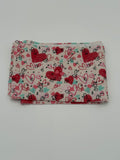 Folded fabric with Valentine’s Day hearts theme pattern on a white background