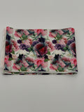 Folded fabric with floral pattern on a white background