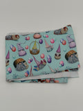 Folded fabric with Easter gnomes  pattern on a white background