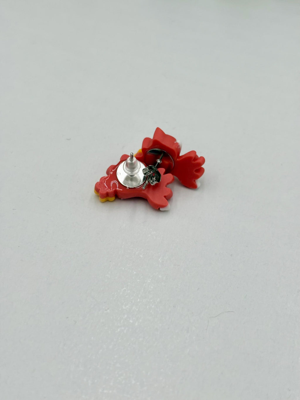 Red fox earrings on a white background