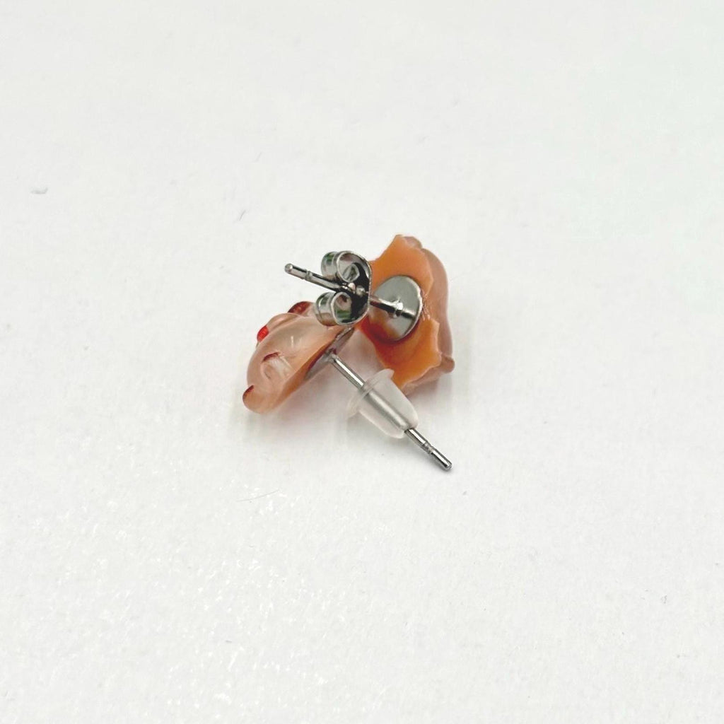 Handmade capybara earrings on a white background