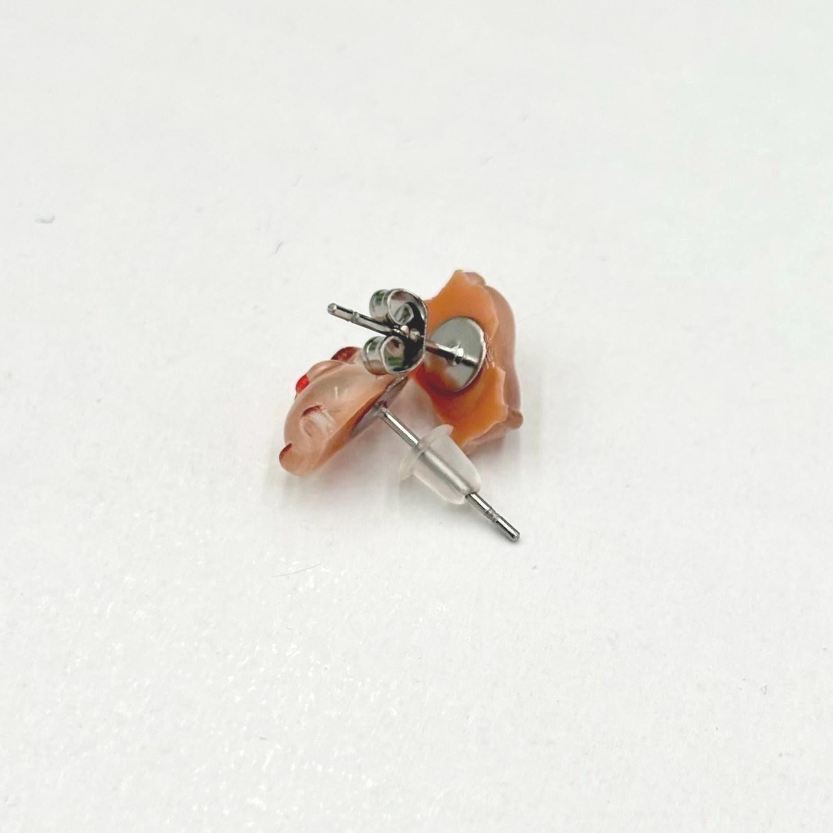 Handmade capybara earrings on a white background