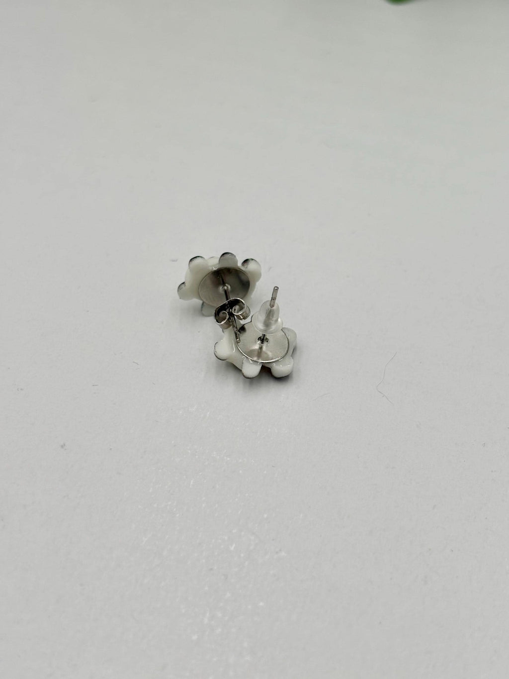 panda shaped earrings on a white  background