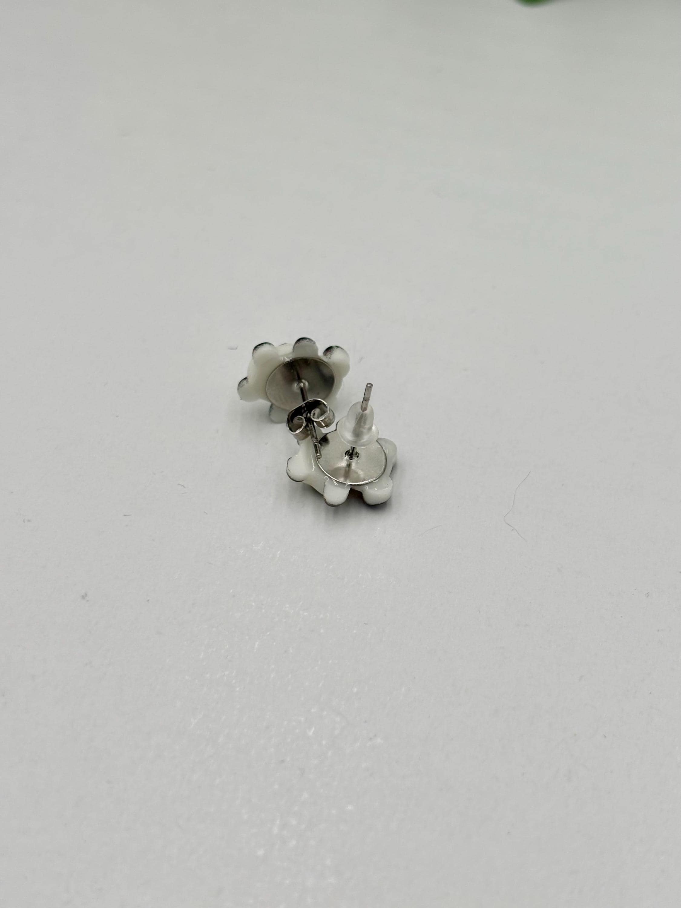 panda shaped earrings on a white  background