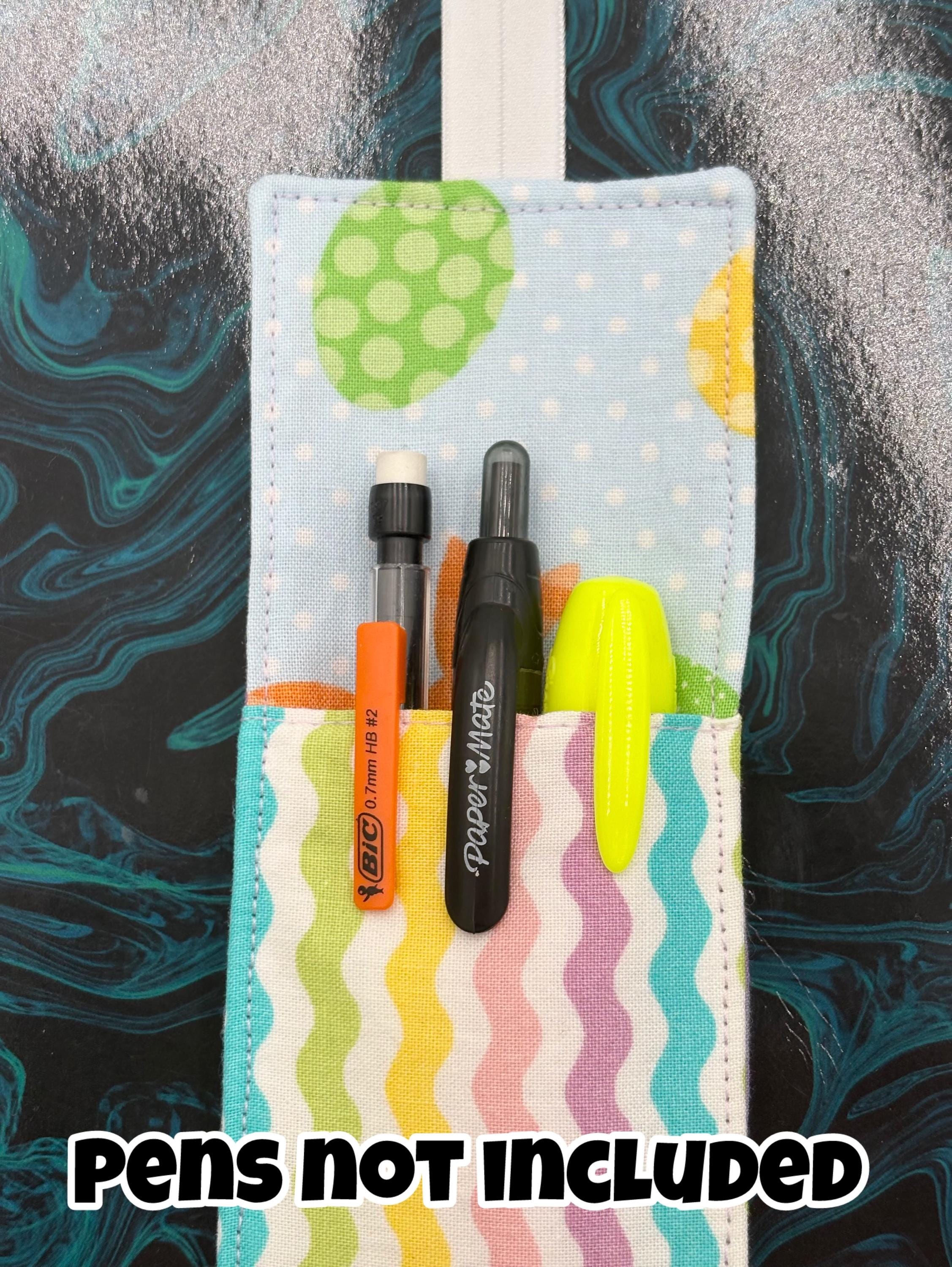 Pastel multicolored pen holder bookmark on a textured background