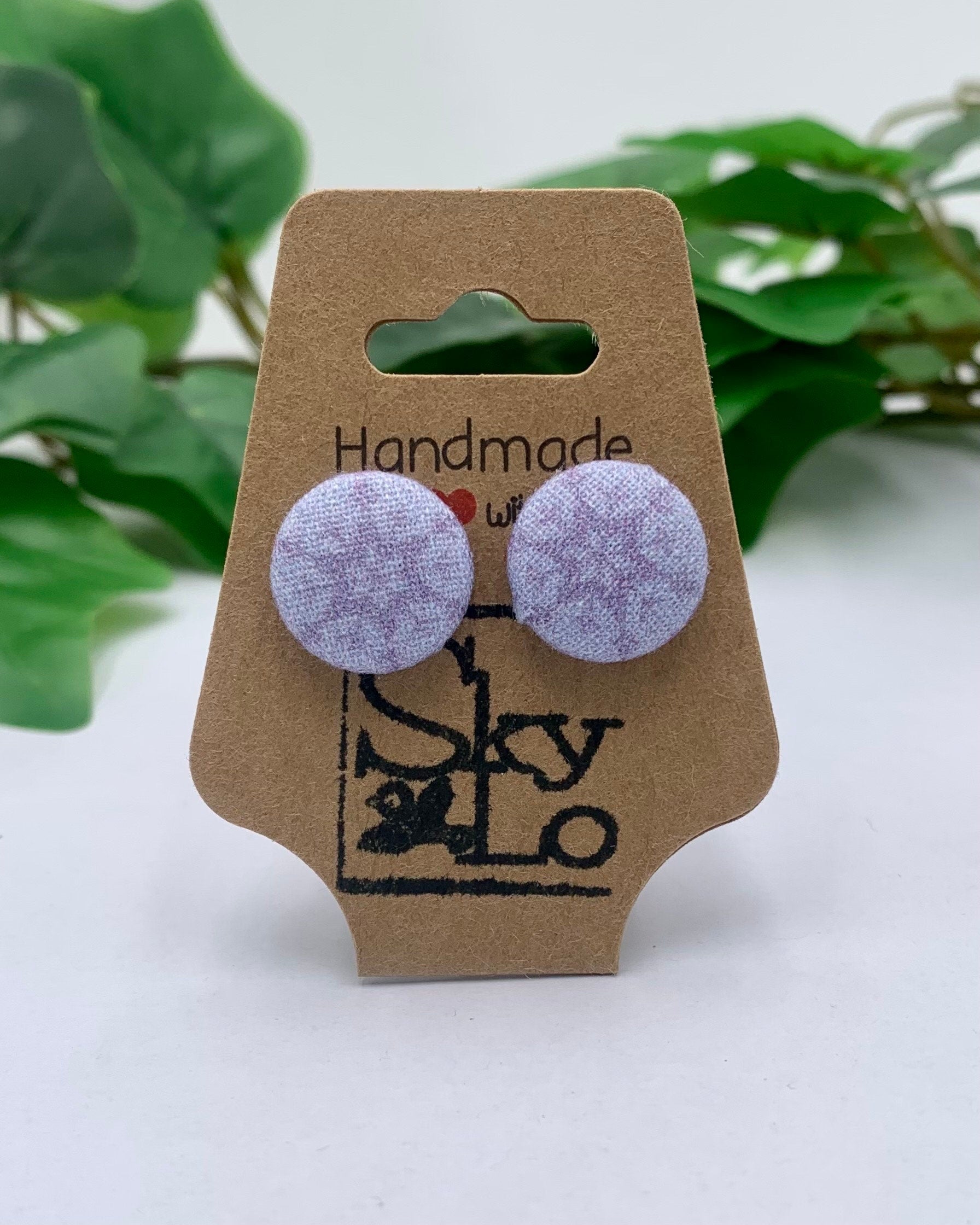 Pair of lavender round earrings on a 'Handmade with SkyLo' branded card with green leaves in the background.