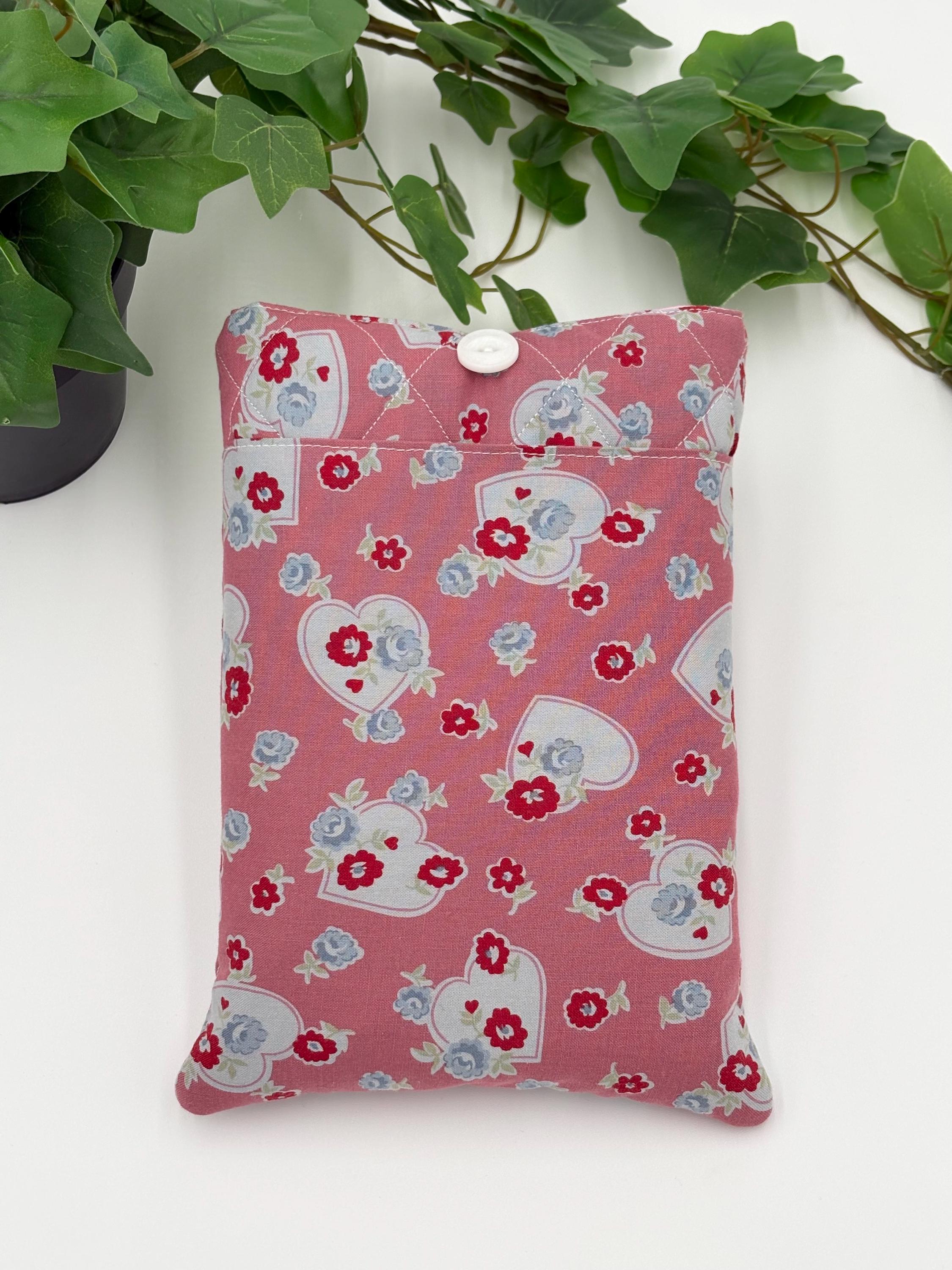 Front of the Floral and heart patterned book sleeve on a white background